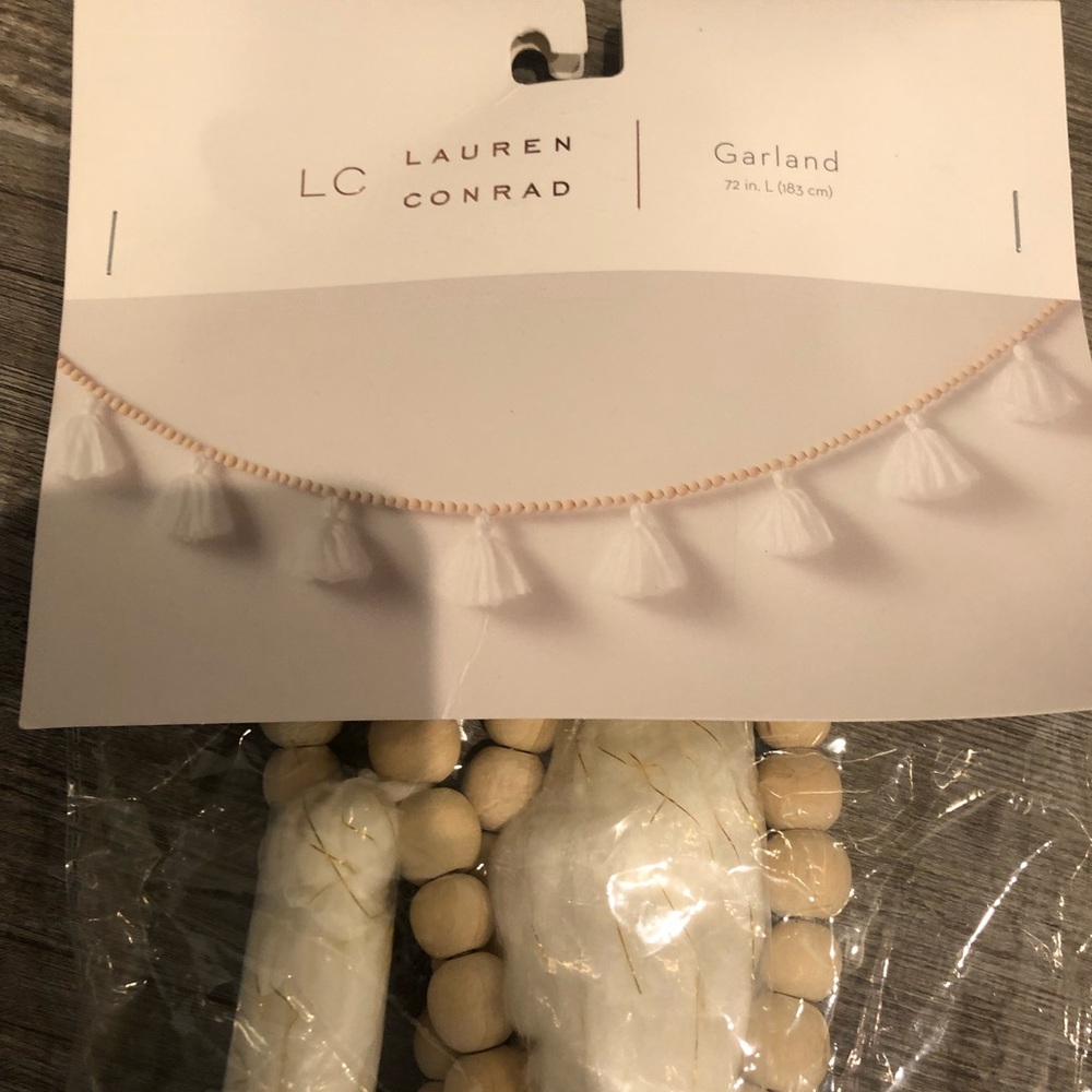 Lauren Conrad garland widen beads and white tassels 72in long